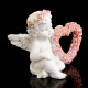 Фигурка полистоун "Ангел с рамкой-сердечком из роз" 6,2х7,6х4 см